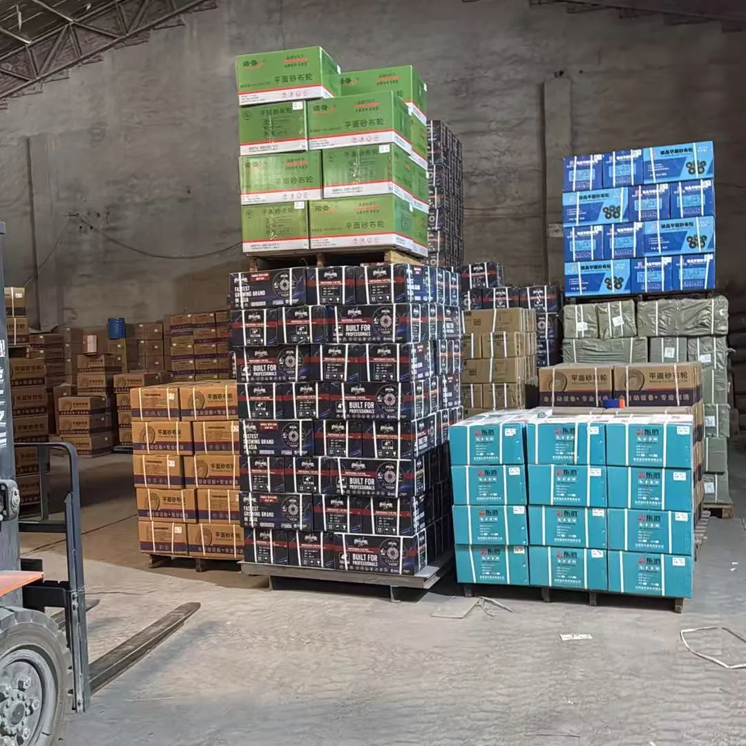 Stacked pallets of packed WanHu grinding wheels and abrasive goods in the Qingyuan warehouse